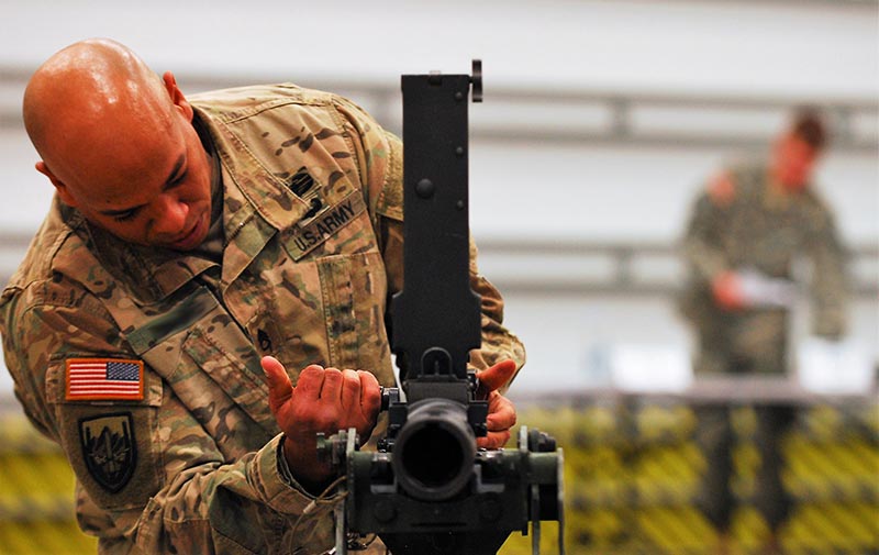 Soldier assembling a gun during a best warrior competition