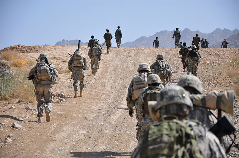 Soldiers patrol on foot 