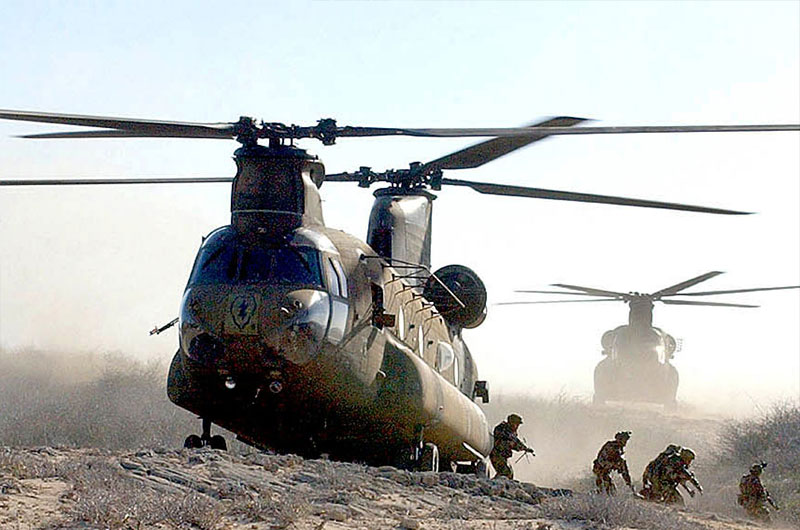 Soldiers departing from a helicopter