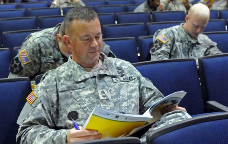 A sergeant reads a packet