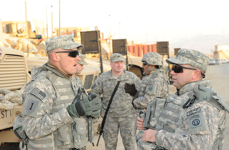 Soldier leader sharing positive reinforcement with subordinates