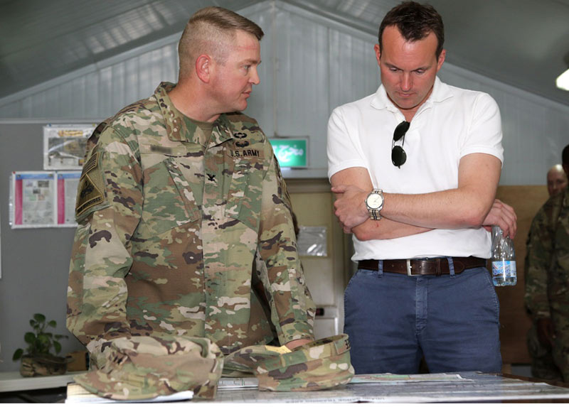 Commander having a discussion with the Secretary of the Army 