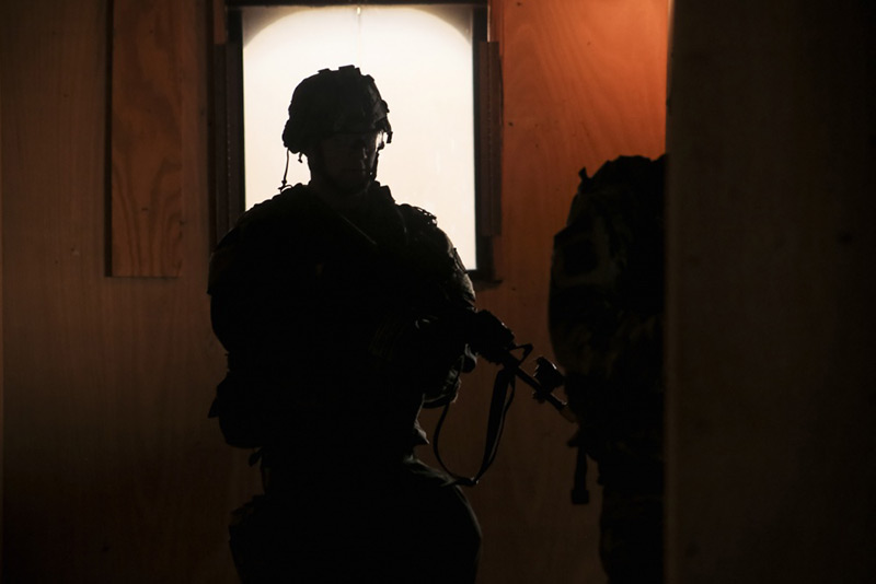 Soldier standing in the dark
