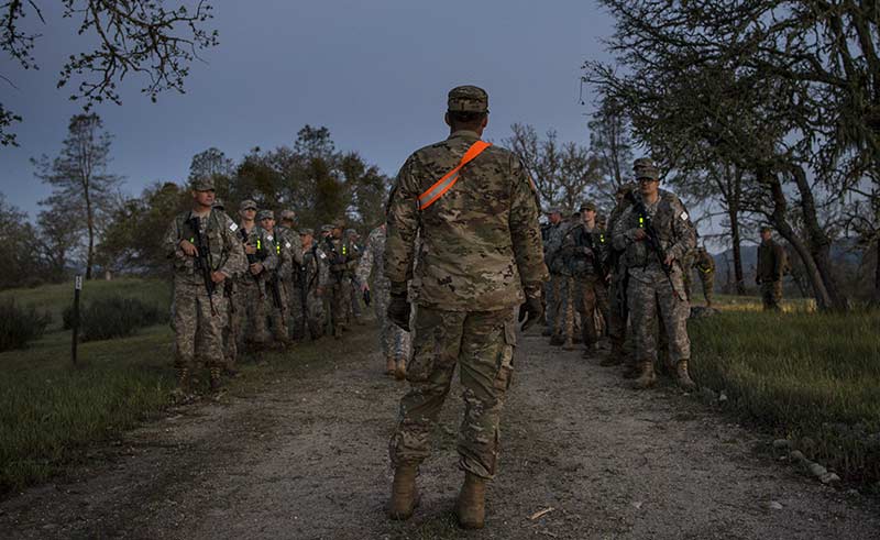 Squad leader addressing a group of Soldiers