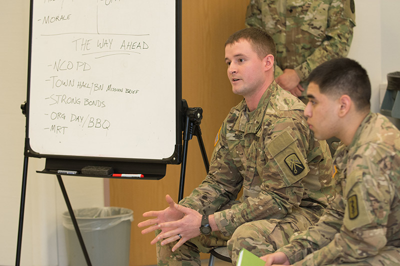 Soldiers sitting down and talking